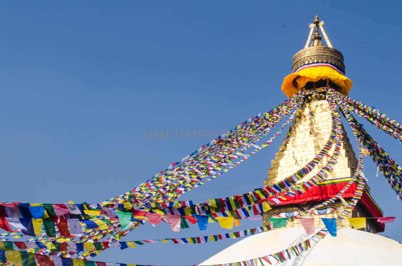 the famous buuha eye gazing out sleepily from each side of the tower are those of the all seeing primordial buddha.perched a top a hill on the western edge of the kathmandu valley.