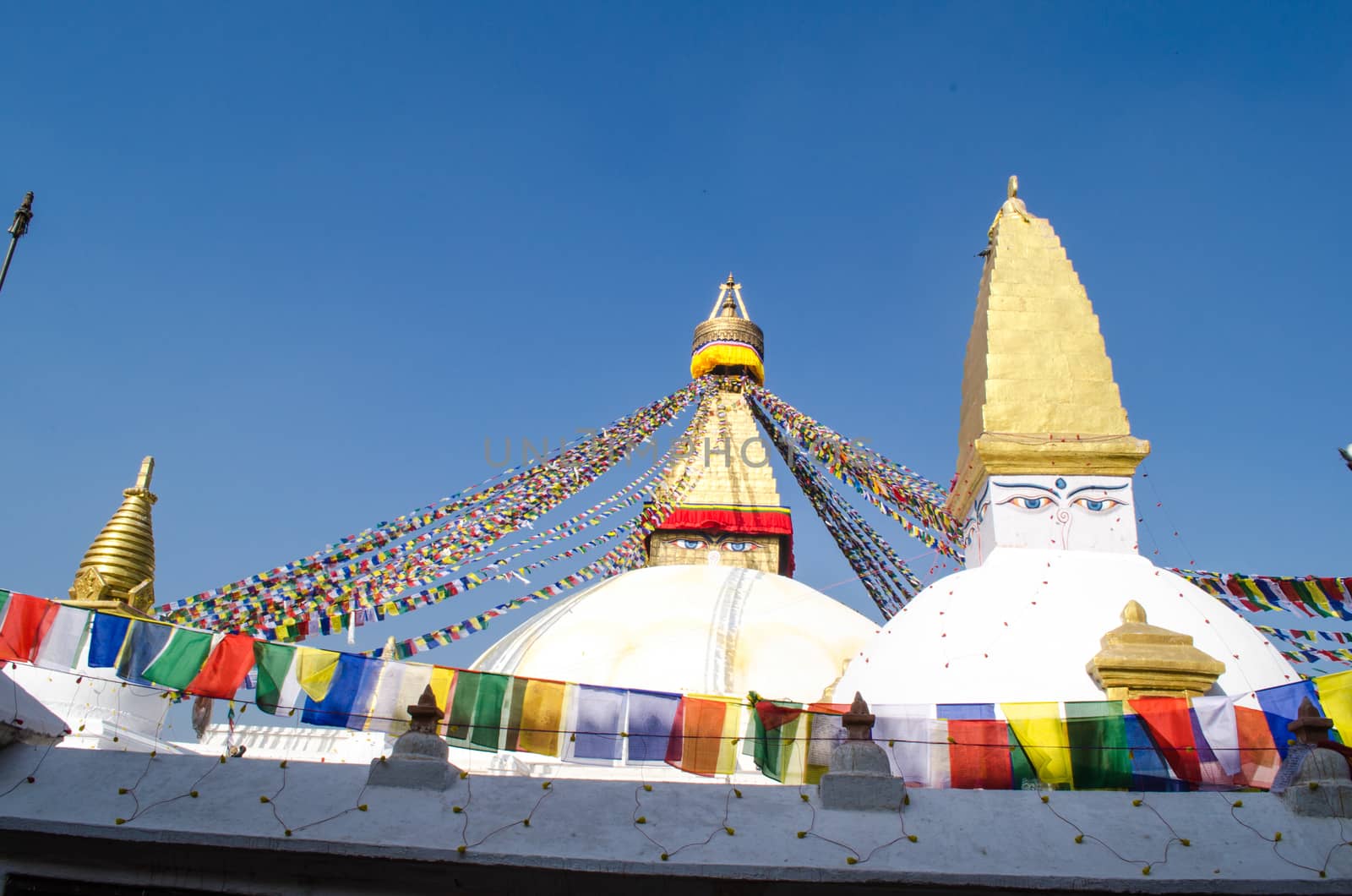 the famous buuha eye gazing out sleepily from each side of the tower are those of the all seeing primordial buddha.perched a top a hill on the western edge of the kathmandu valley.