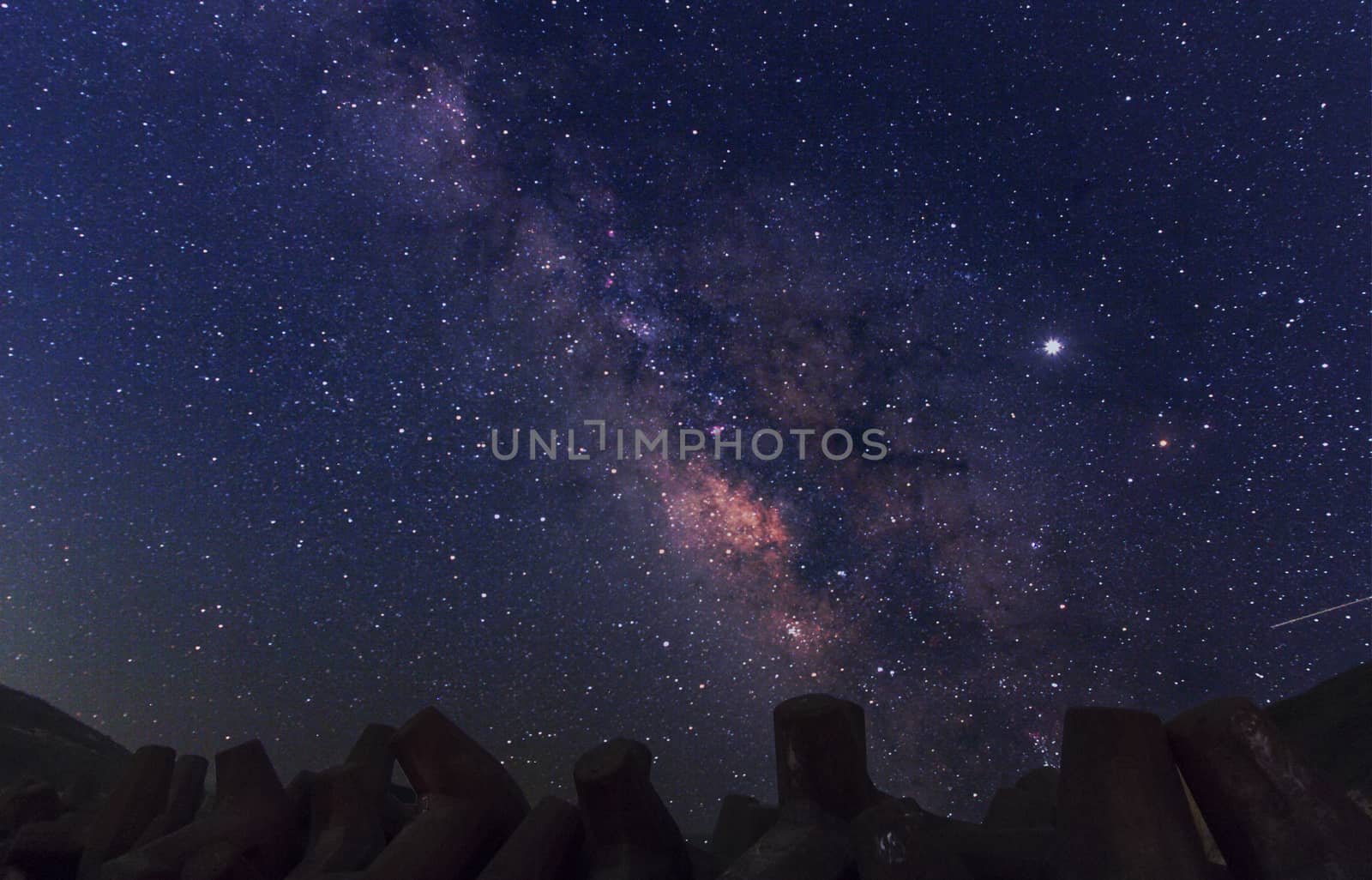 Night landscape with colorful Milky Way. Starry sky  at summer. Beautiful Universe. Space background