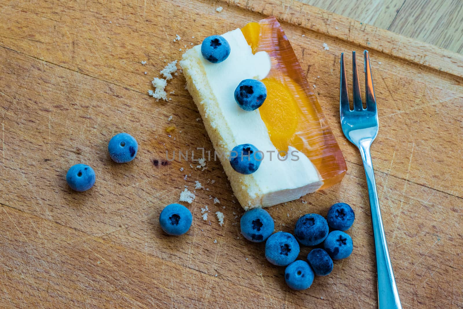 Delicious and sweet cake with blueberries. Sunny dessert on the  by wytrazek