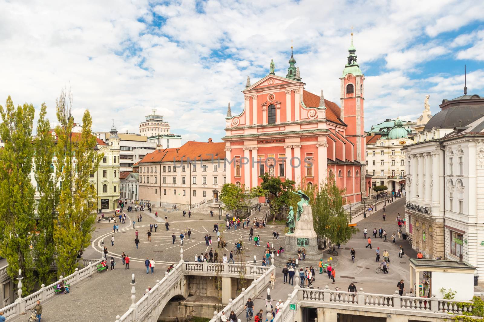 Romantic Ljubljana's city center: river Ljubljanica, Triple Bridge, Tromostovje, Preseren square and Franciscan Church of the Annunciation. Ljubljana, Slovenia, Europe.