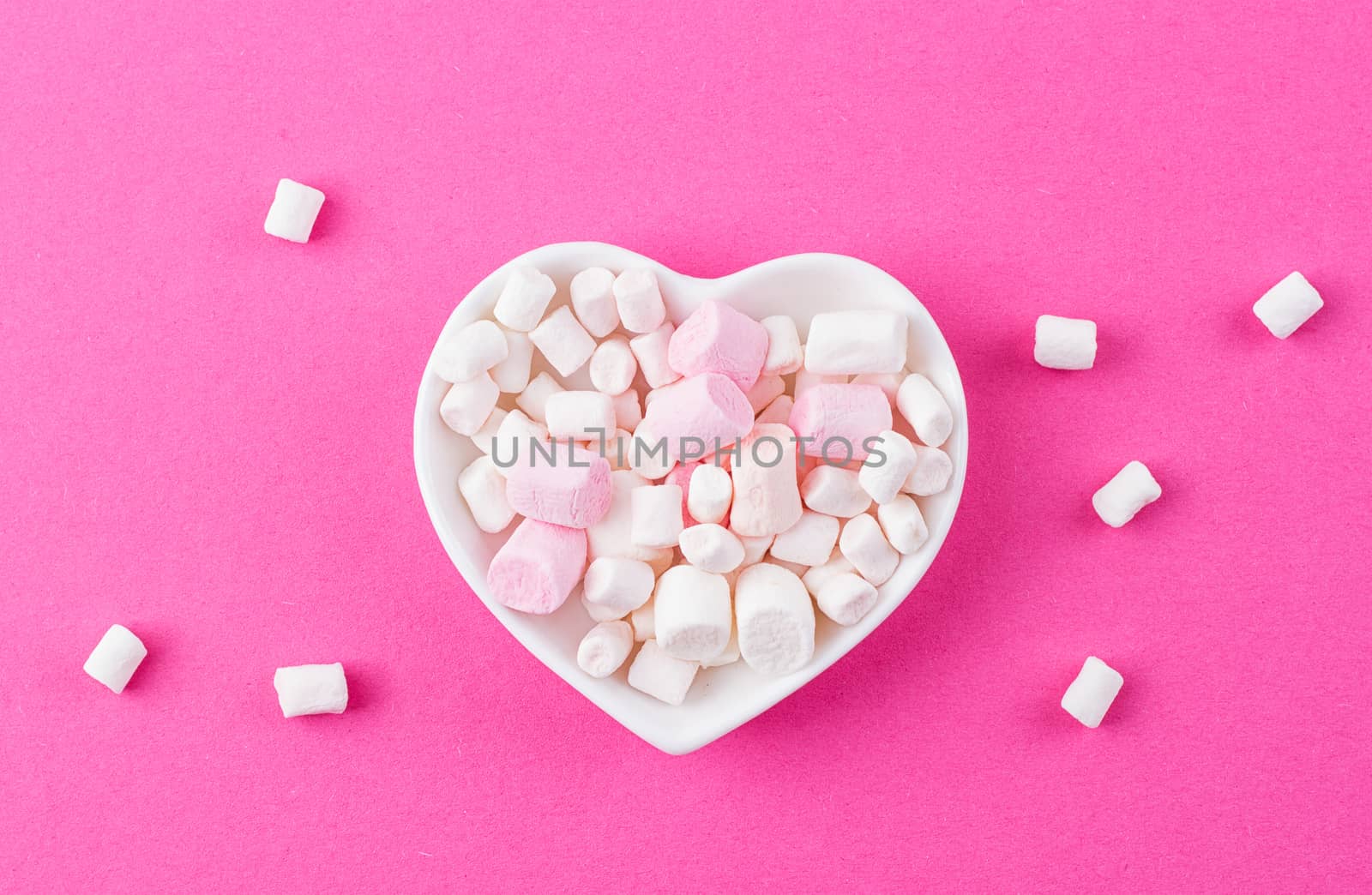 red heart-shaped plate with marshmallows, space for text, congratulations on Valentine's Day, top view