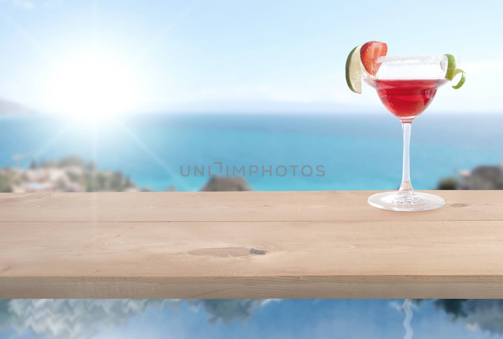 Red cocktail by the sea by unikpix