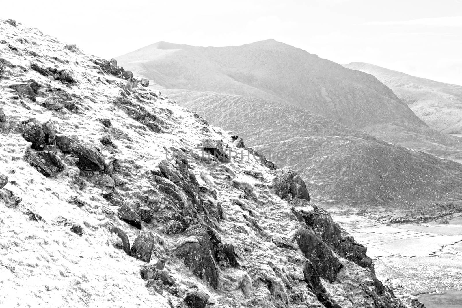 black and white view of the mountains in kerry by morrbyte