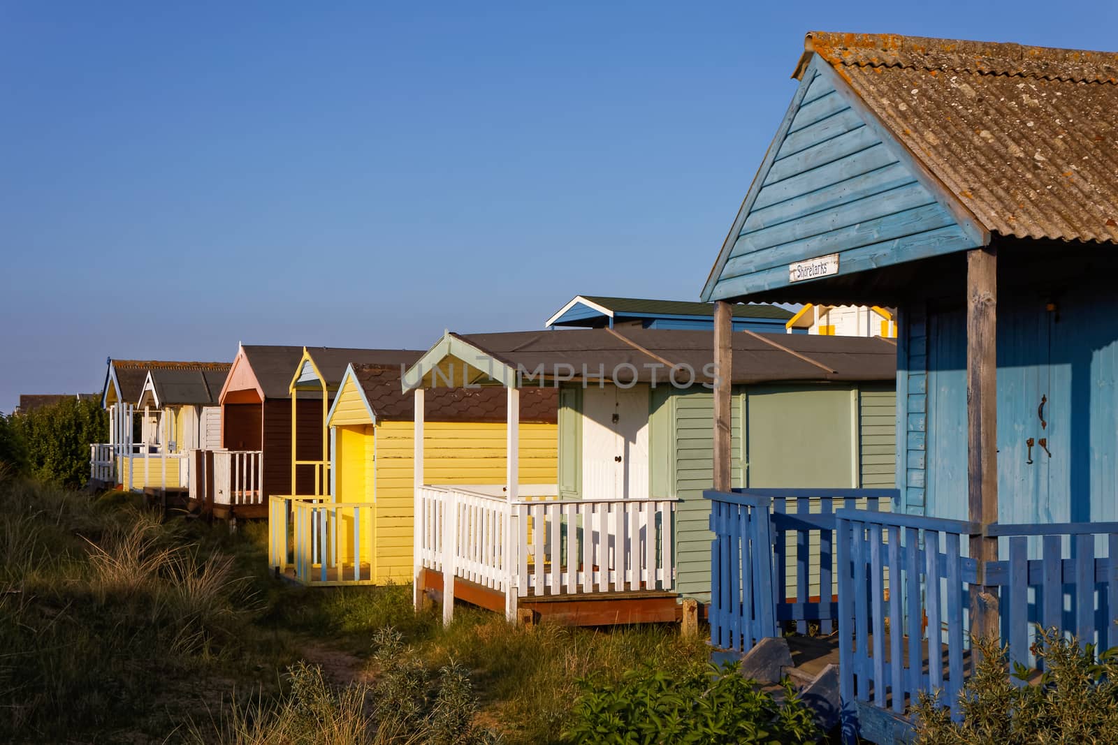 Beach Huts Bathed in Warm Evening Sunlight