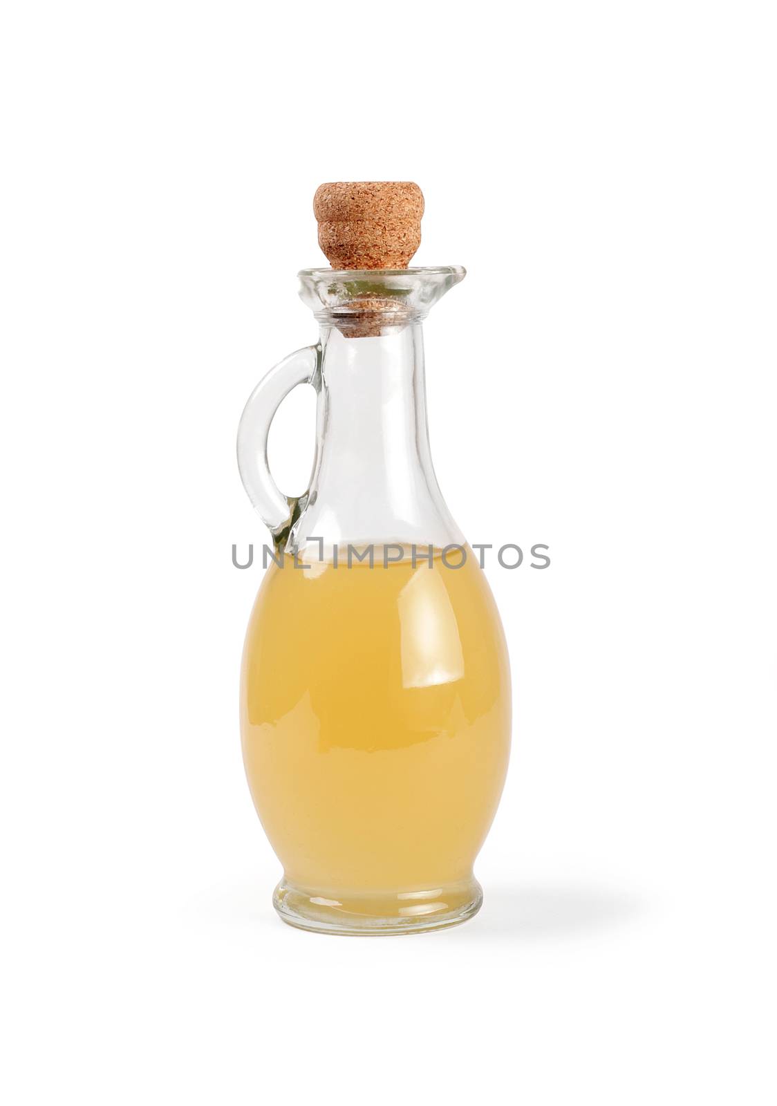 Decanter with apple vinegar isolated on the white background