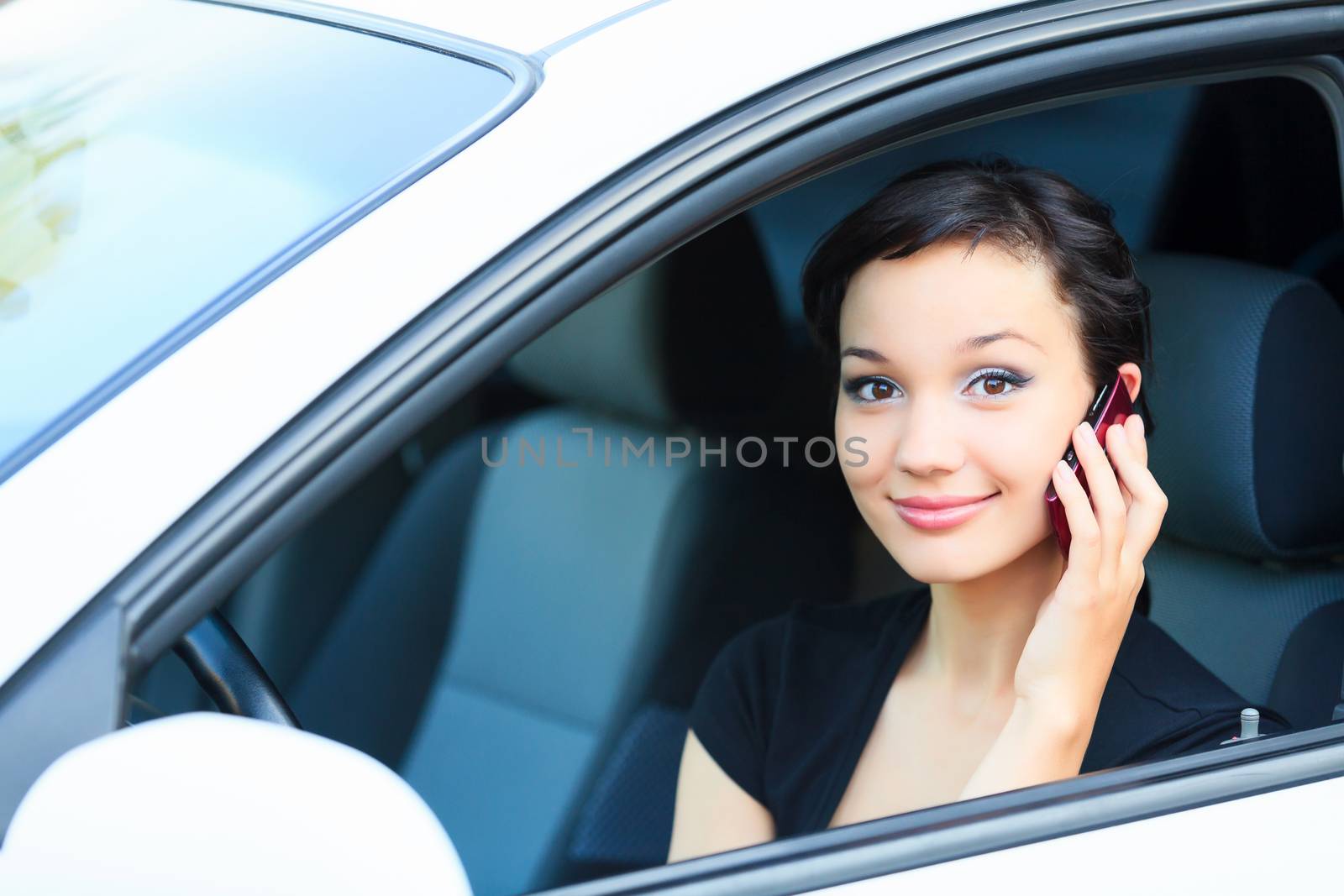 Woman driver using a mobile telephone by Nobilior