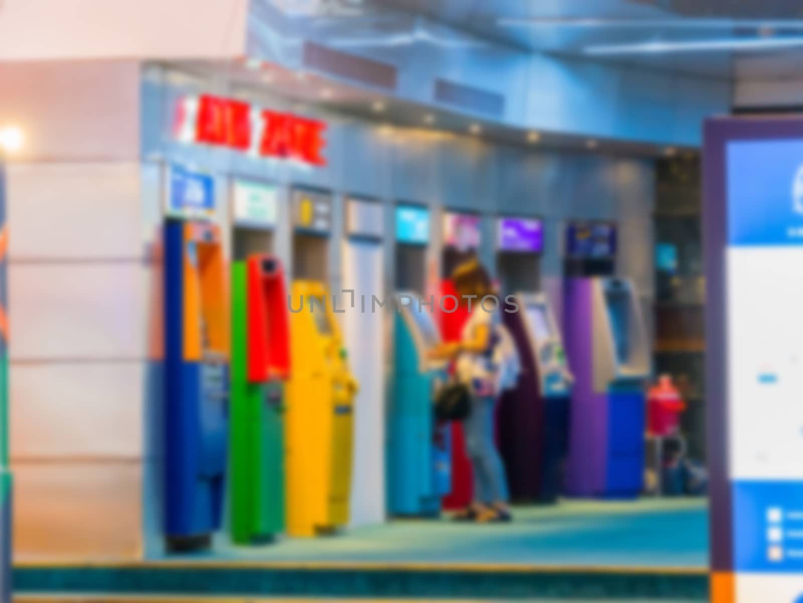 Blurred,Women are pressing the money at the ATM.