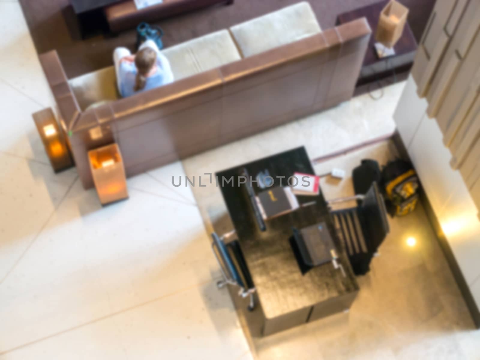 Blurred,The hotel receptionist is currently serving customers.