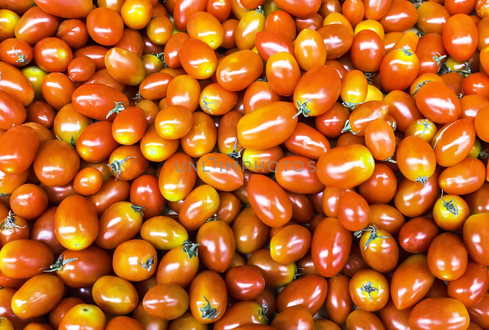Group of fresh red cherry tomatoes background