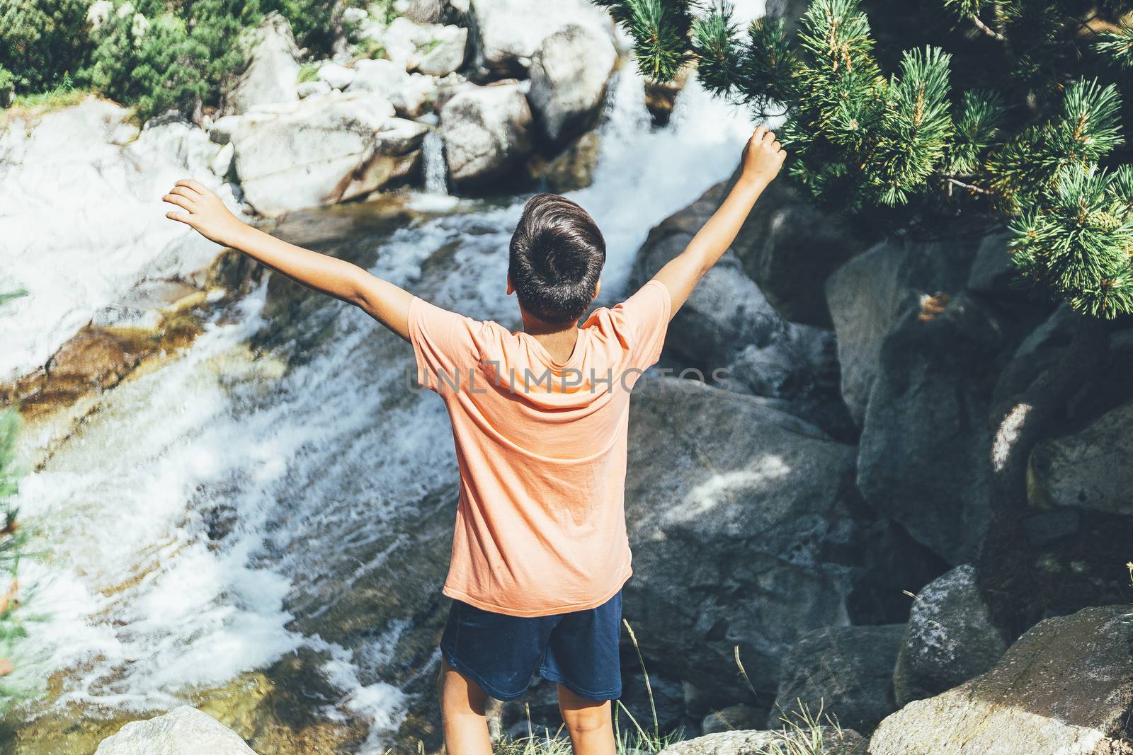 boy in a Mountains and lake photo with reflection