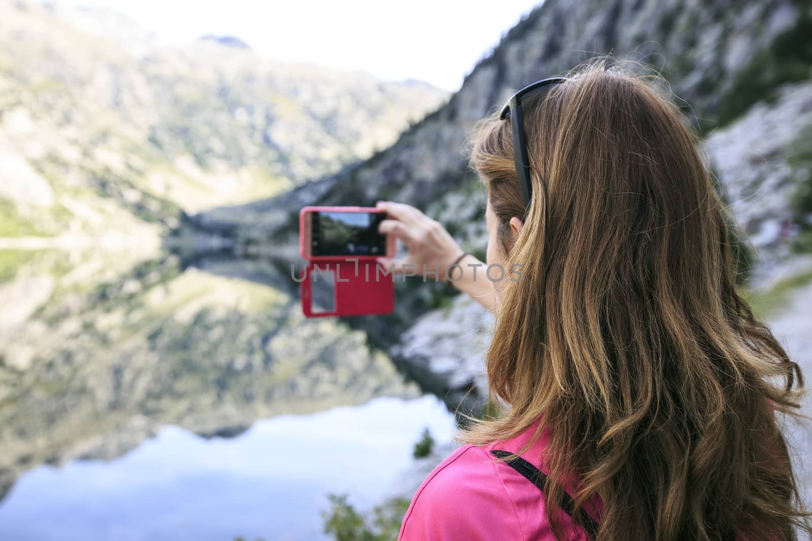 woman making a photo in a lake