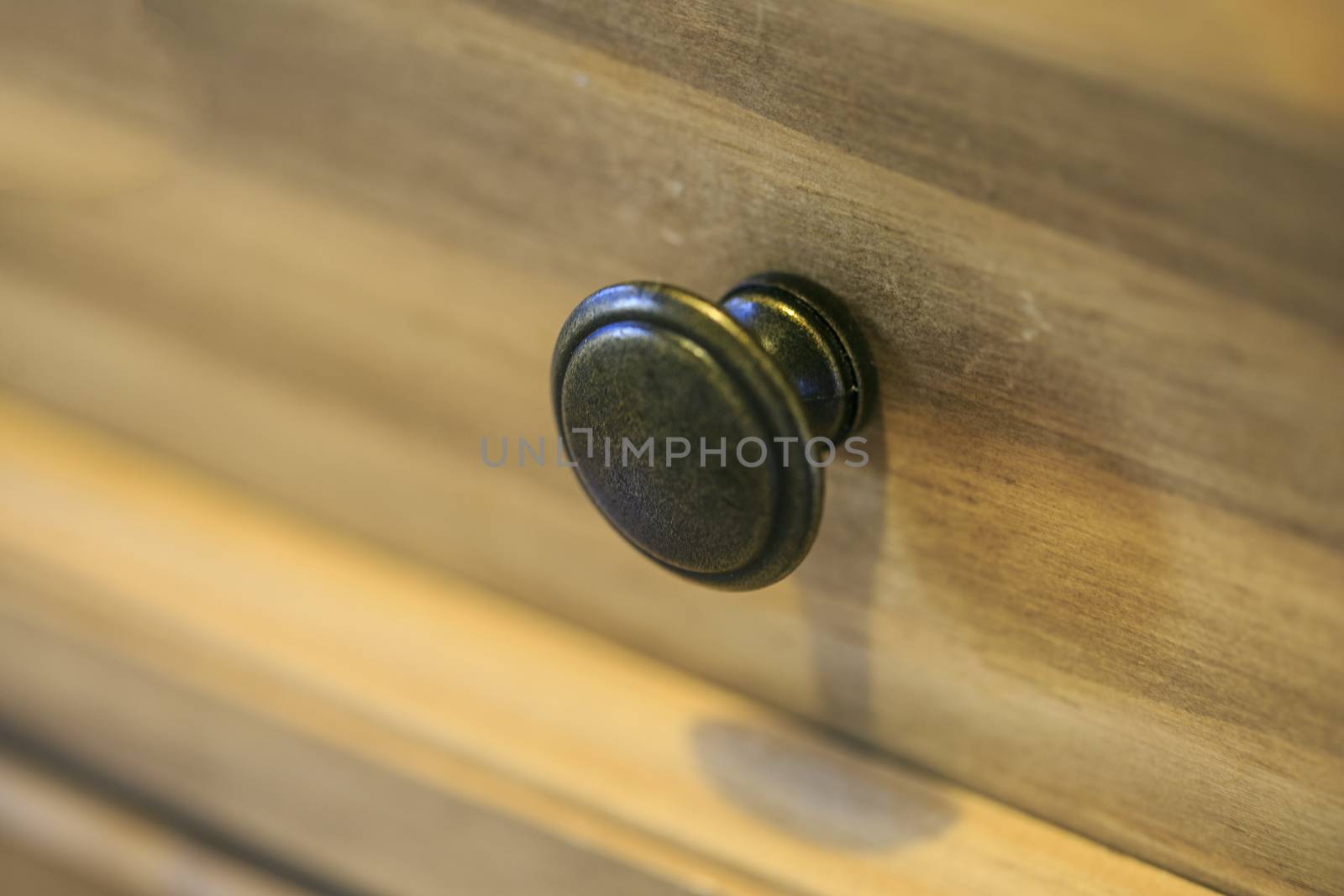 Steel drawer handle in a vintage furniture