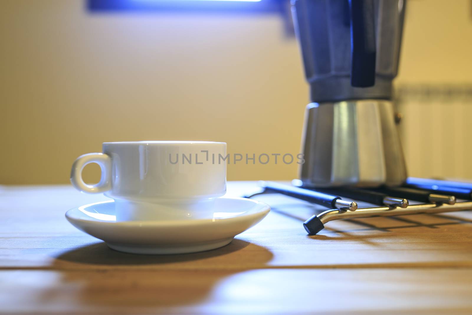 white Cofee cup in a wooden table