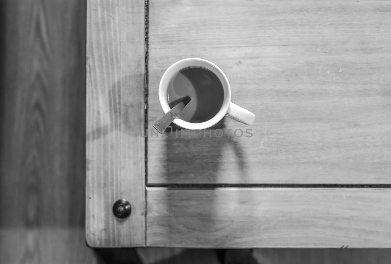 white Cofee cup in a wooden table by nachrc2001