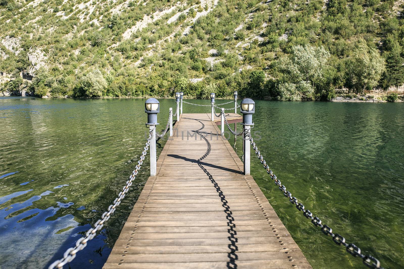 wooden bridge over a lake 