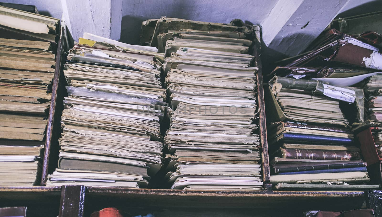 Group of old papers in a library by nachrc2001