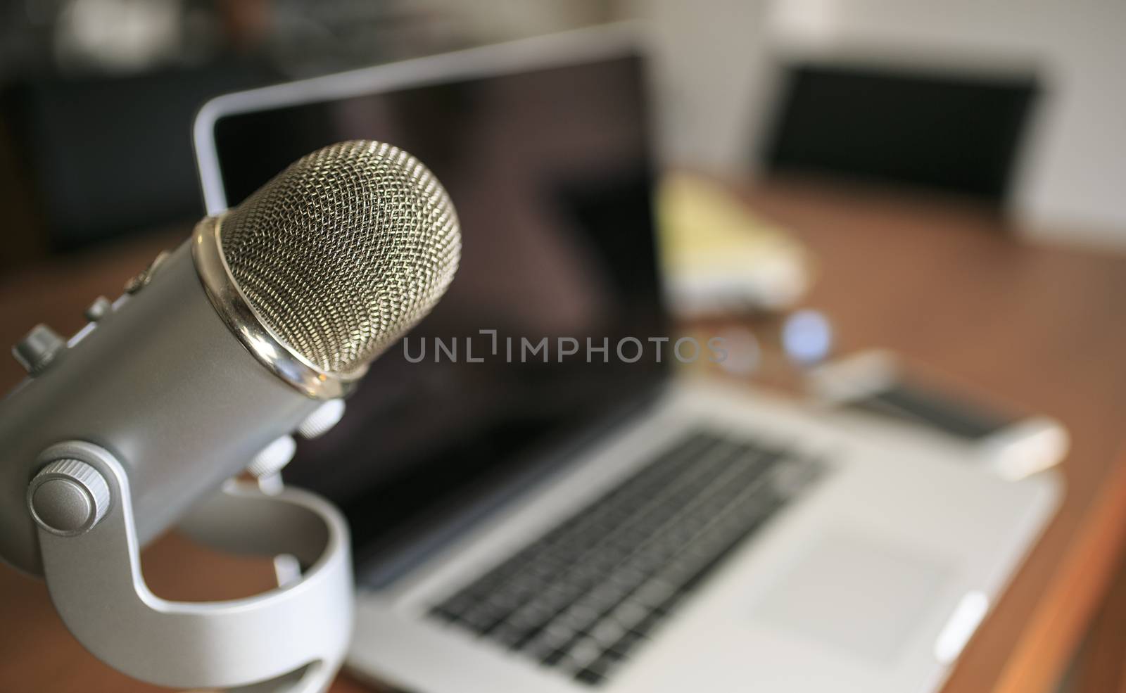 Laptop and mic a a wooden table by nachrc2001