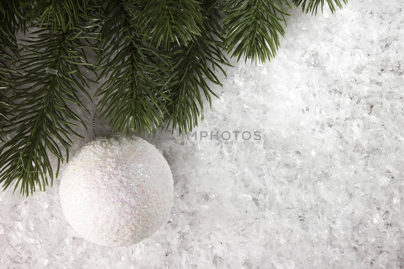 Branch of spruce with decoration in the snow by VIPDesignUSA
