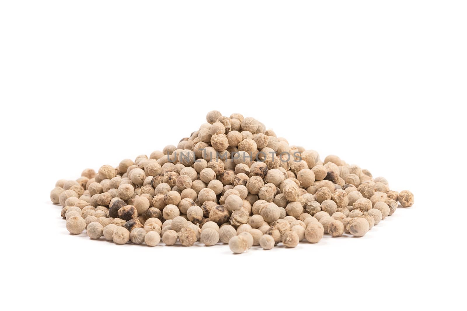White pepper grains isolated on white background.