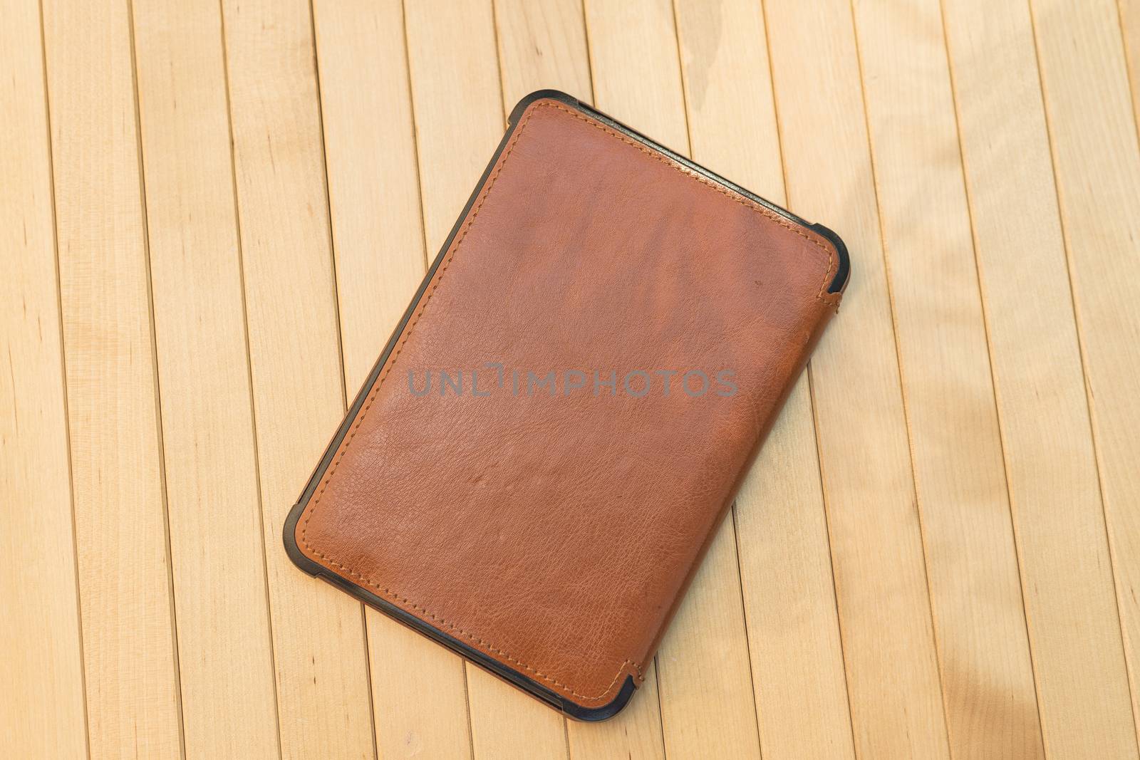 e-book on wooden background