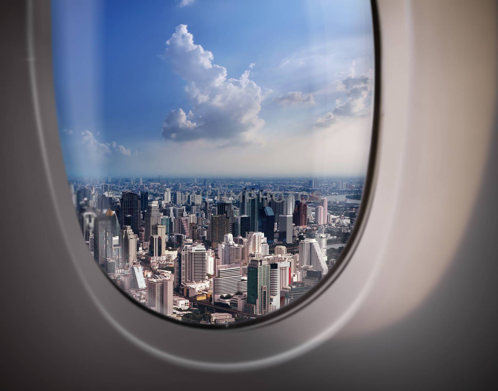 beautiful city view of Bangkok with blue sky from plane window