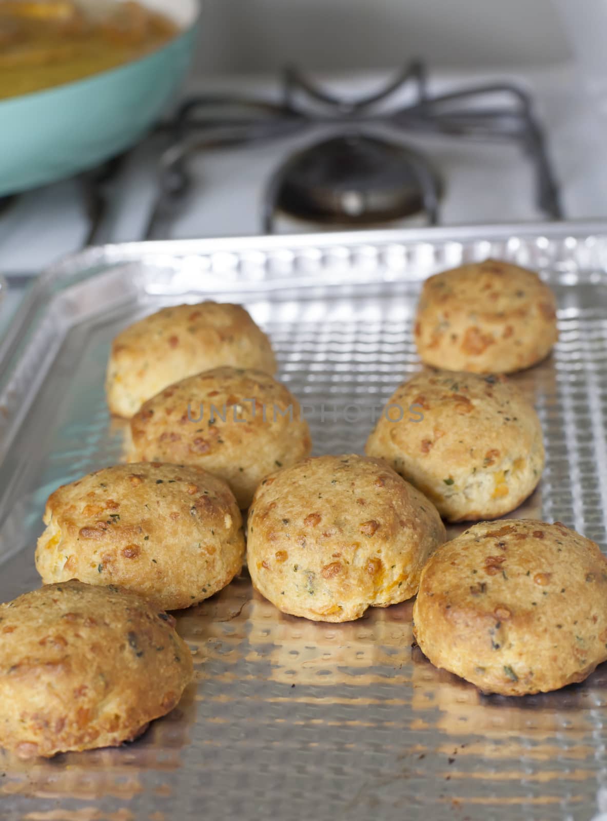 Freshly cooked cheesy biscuits on a baking sheet