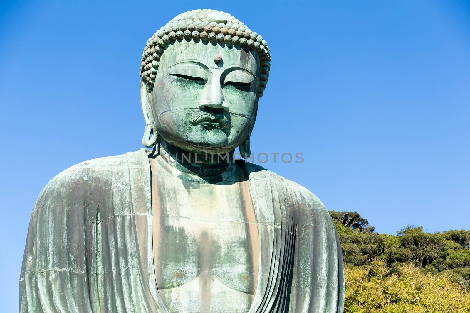 Big Buddha bronze statue and blue sky