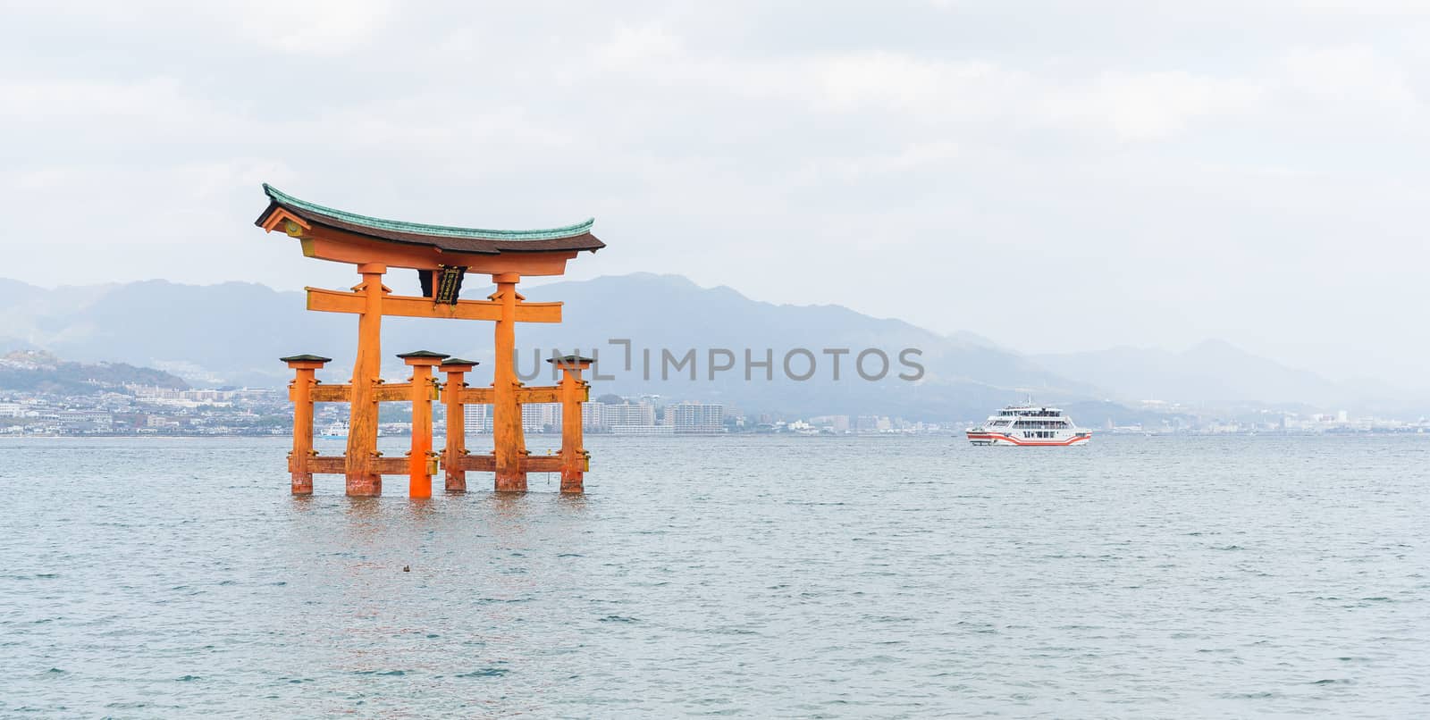 Orange floating Japanese shinto gate in Itsukushima shrine