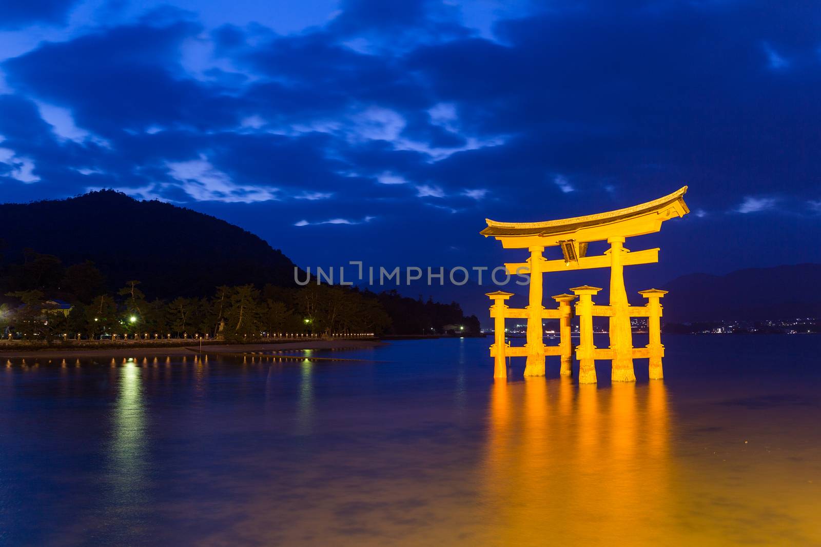 Itsukushima Shrine in Japan at night by leungchopan