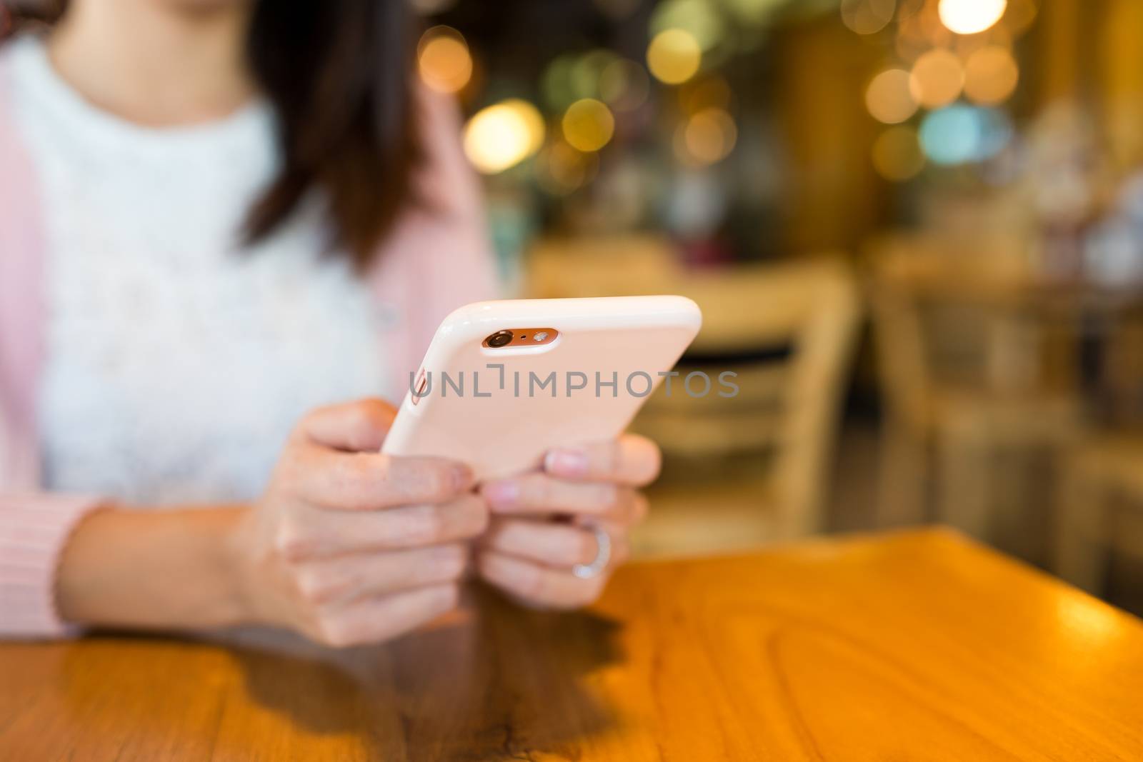 Woman sending text message on mobile phone by leungchopan