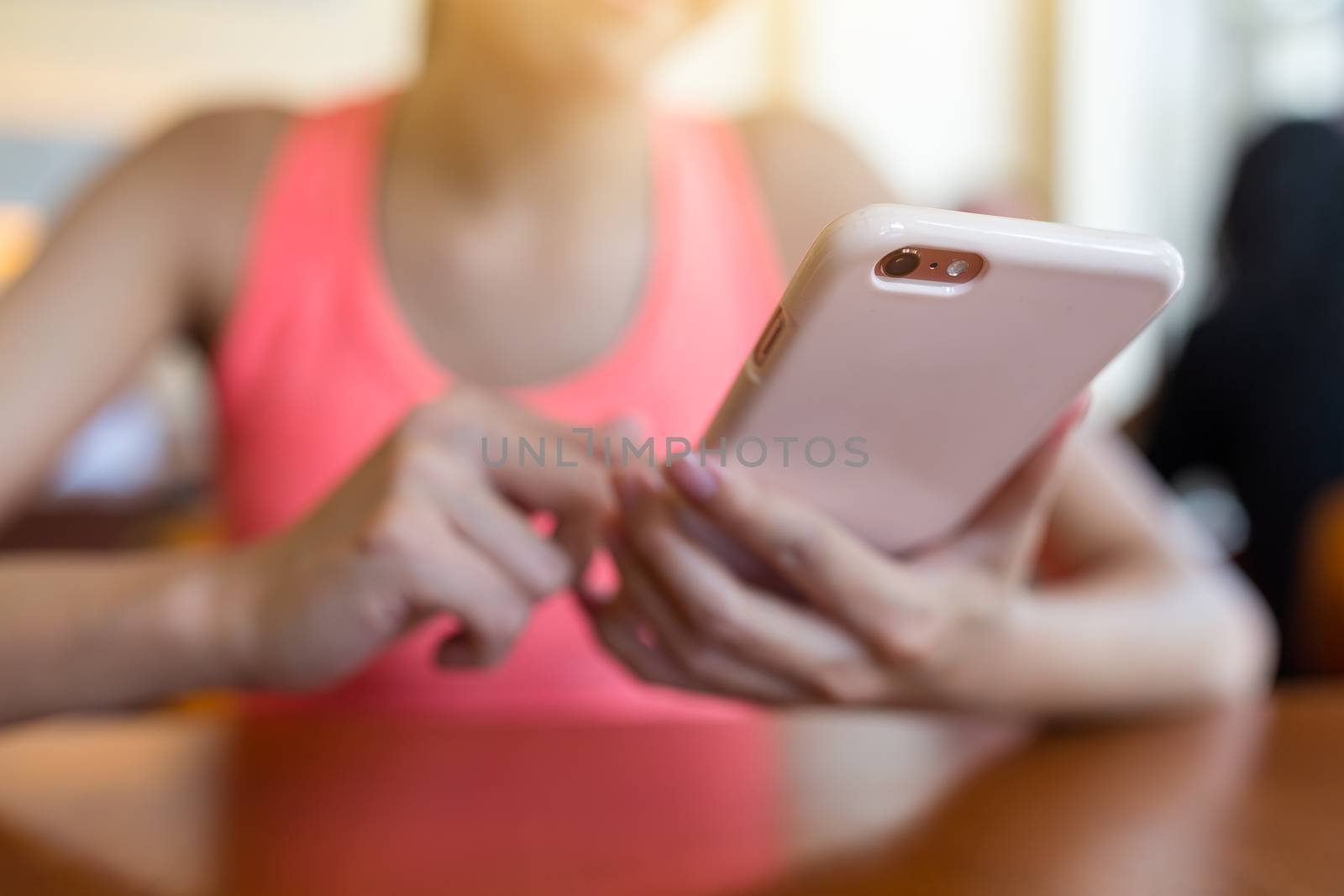 Woman sending sms on cellphone by leungchopan