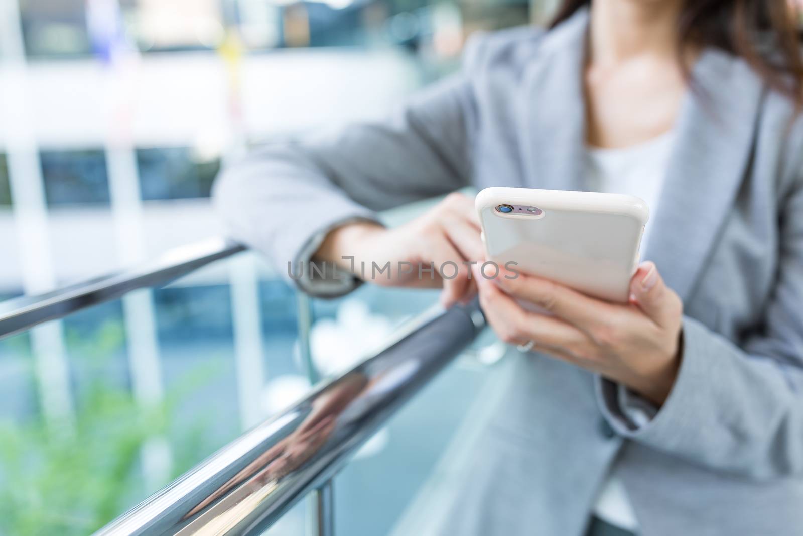 Businesswoman working on cellphone