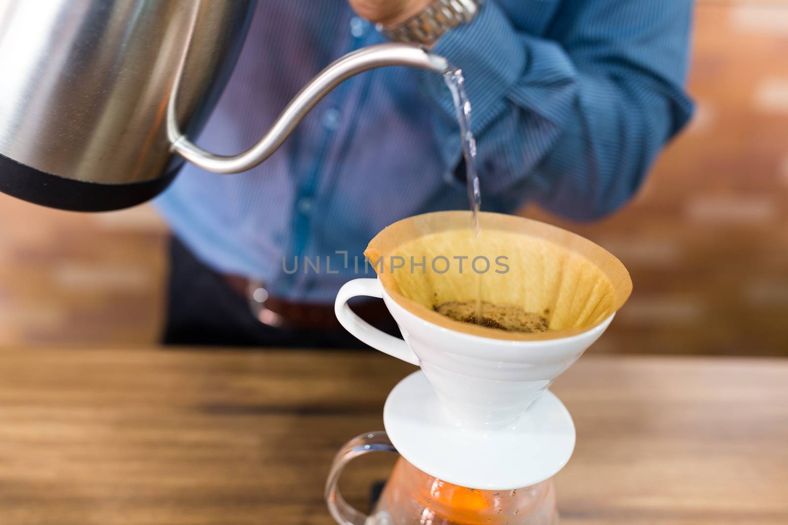 Barista making a drip coffee