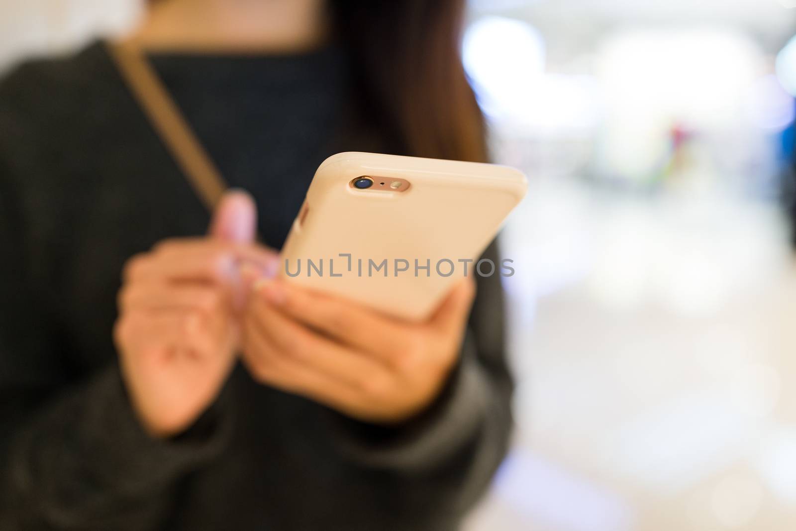 Woman working on smart phone