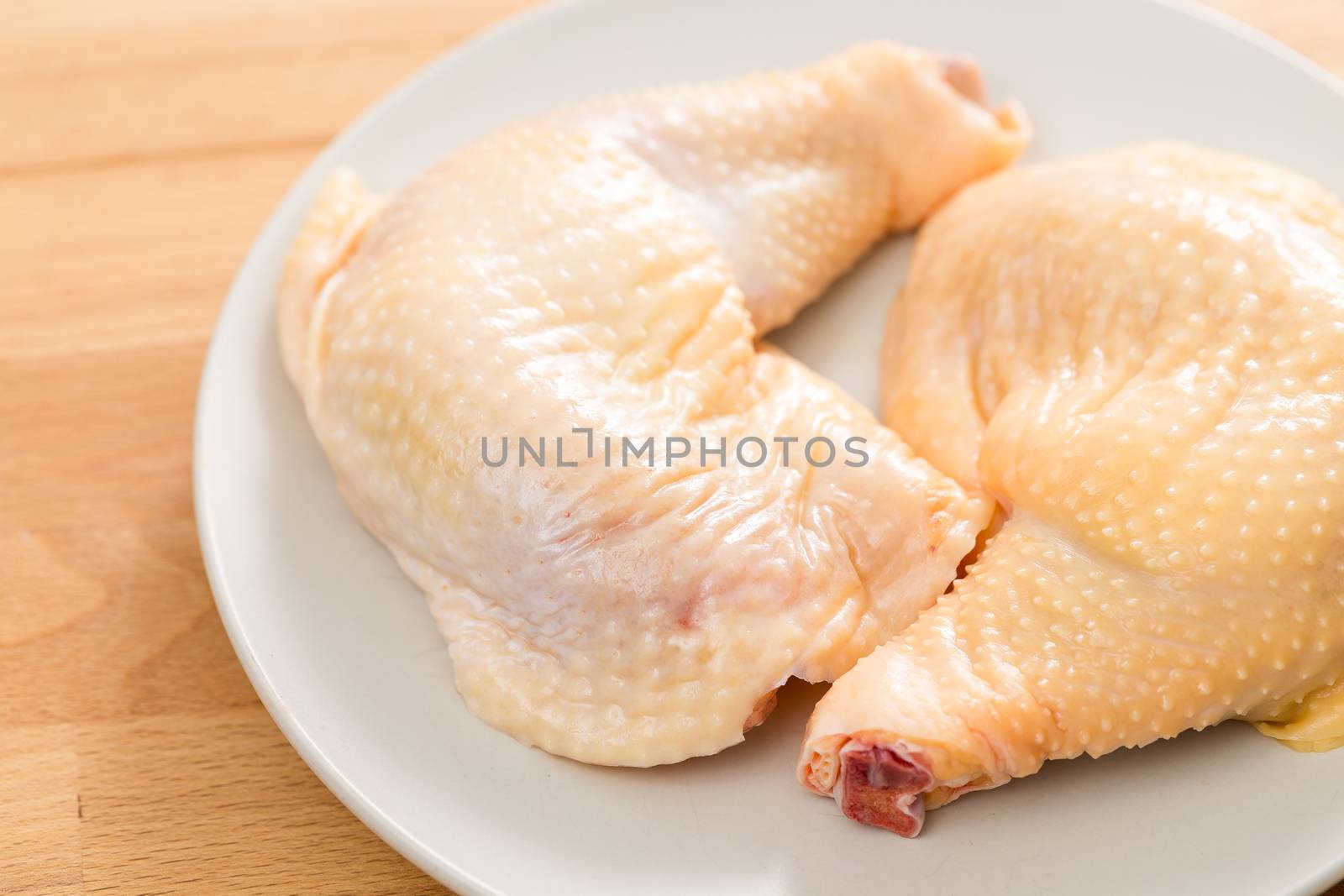 Fresh raw chicken legs by leungchopan