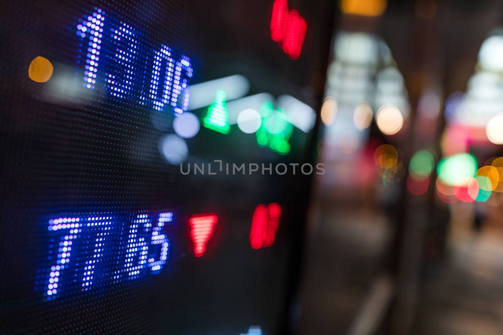 Stock market price display in the city at night by leungchopan