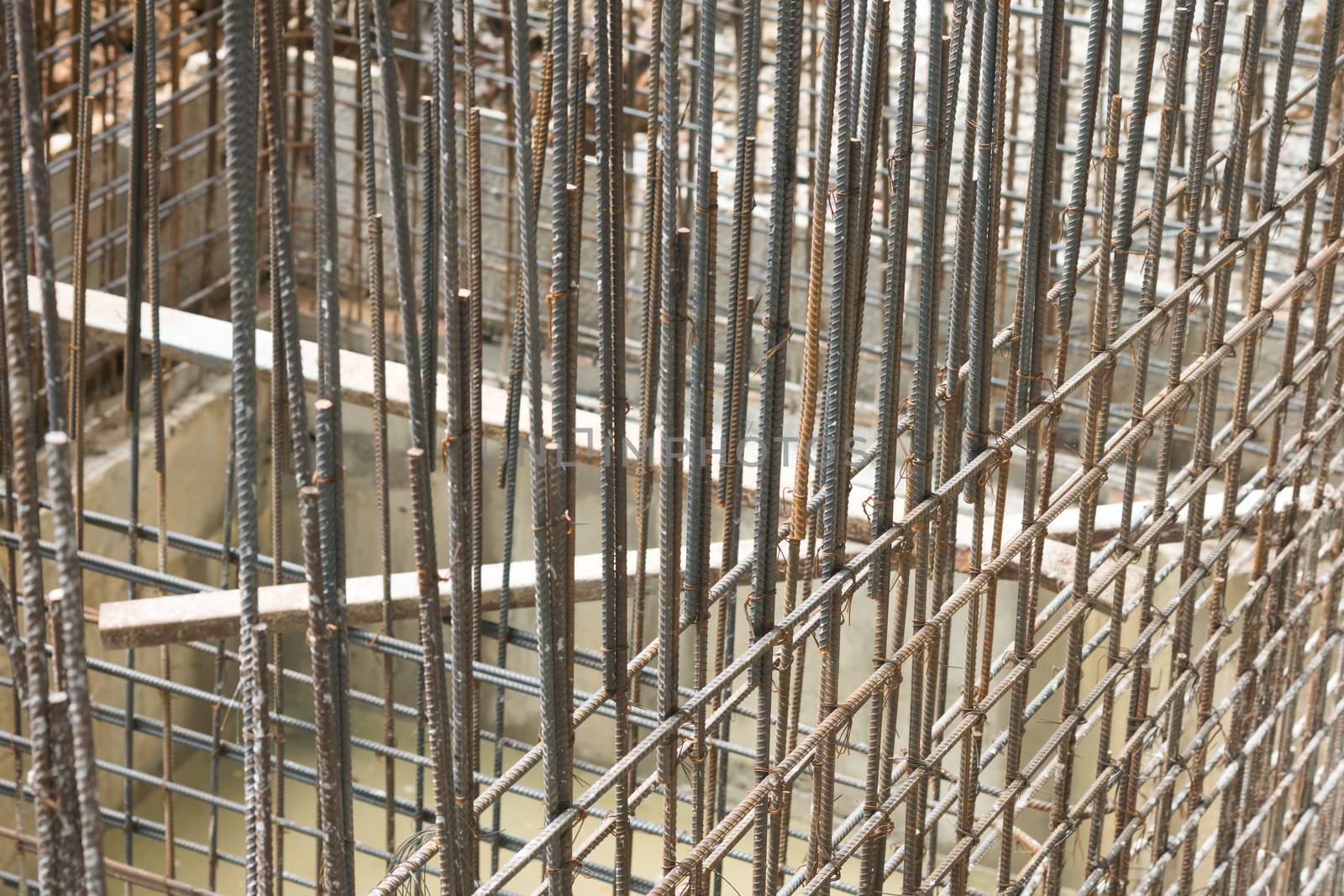 Rebar steel bars, reinforcement concrete bars with wire rod used in foundation of construction site.