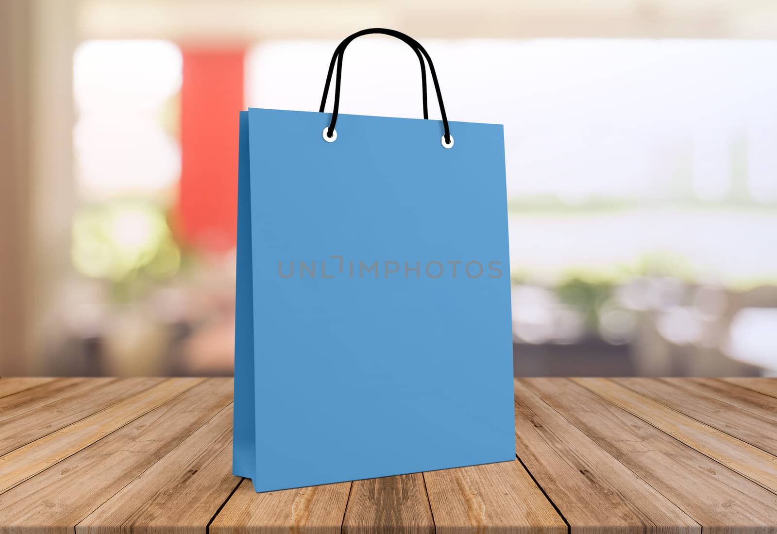 blue paper bag for shopping on a wooden background