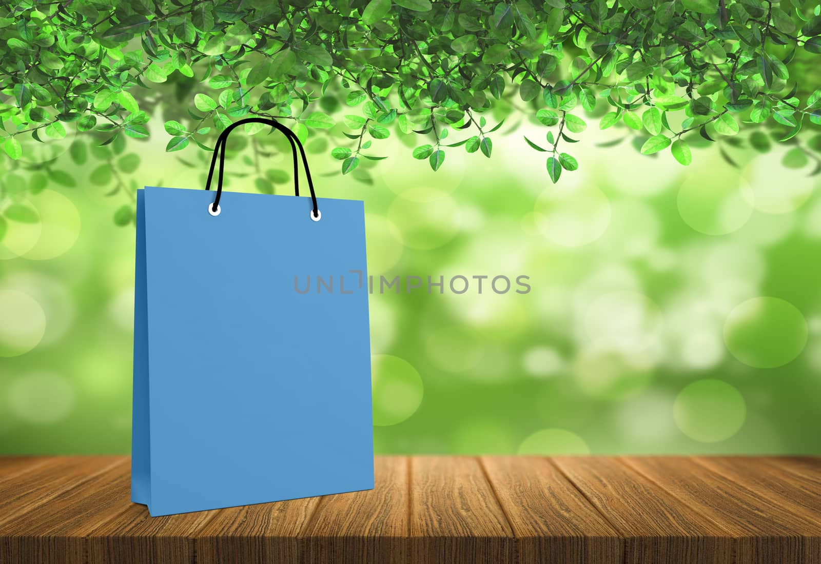 blue paper bag for shopping on a wooden background by boys1983@mail.ru