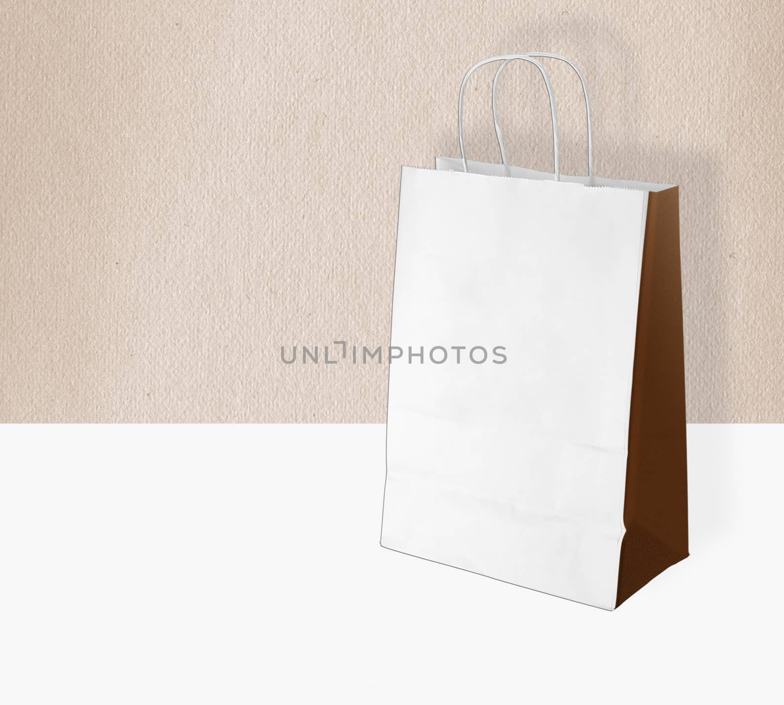 light paper bag for shopping on a light background by boys1983@mail.ru