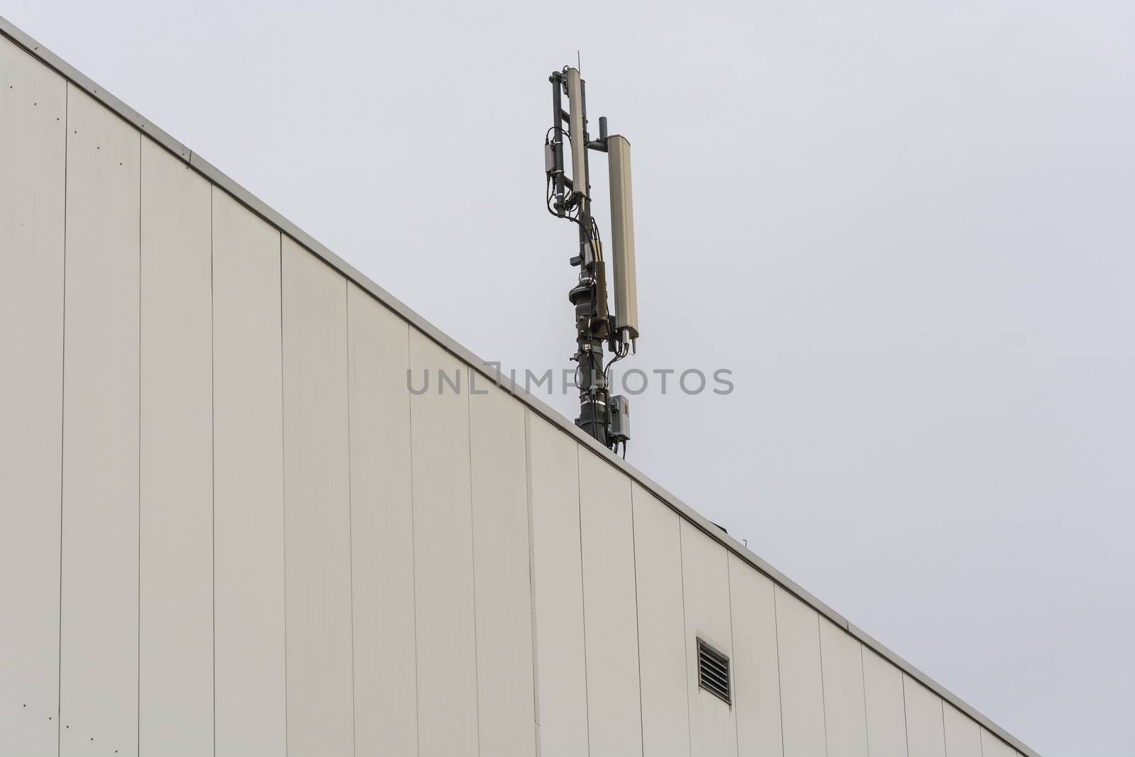  Antenna, telecommunications tower on a roof          by JFsPic