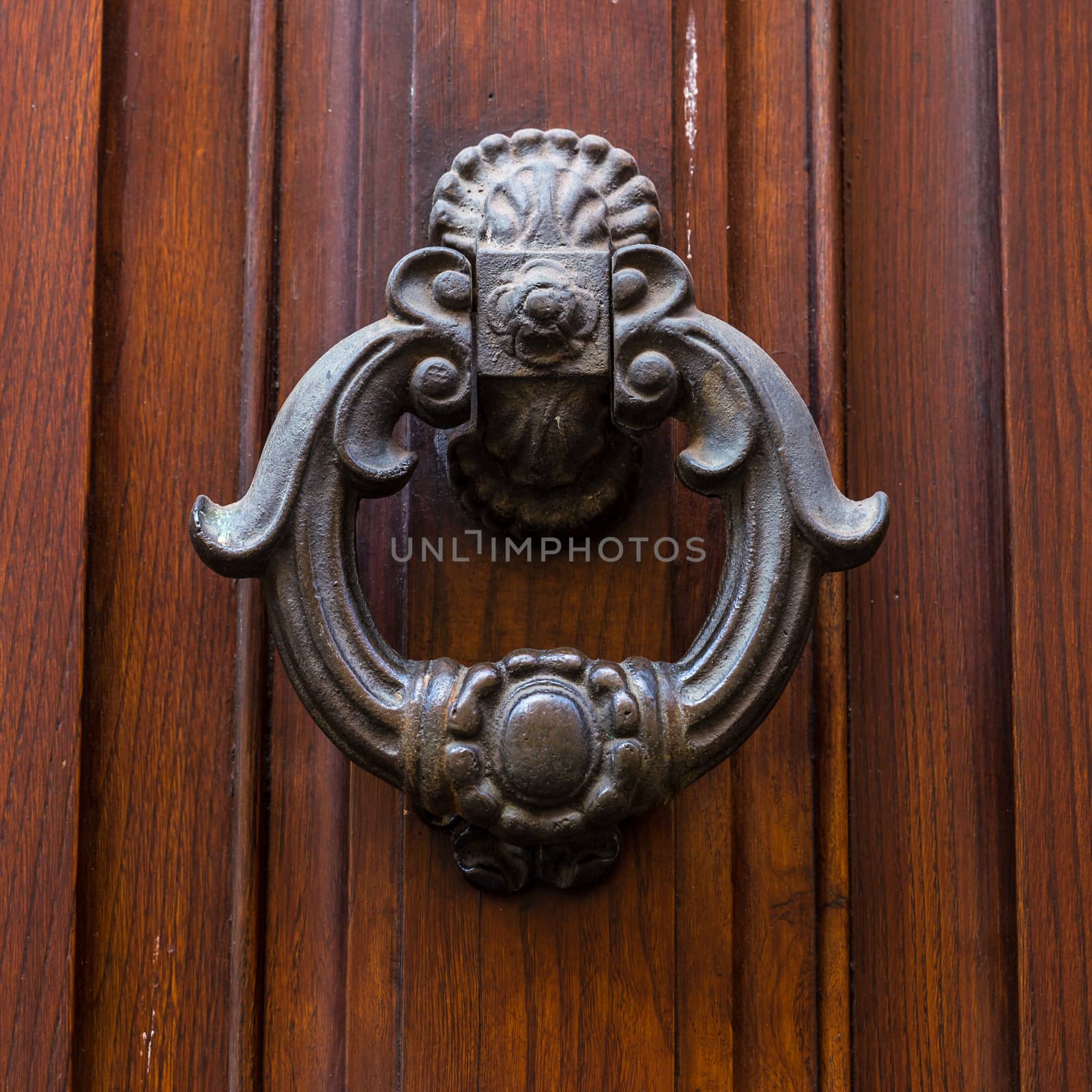 Close up of rustic old door in Florence, Italy.