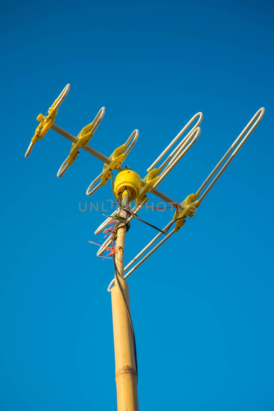 Antenna Television and blue sky background.