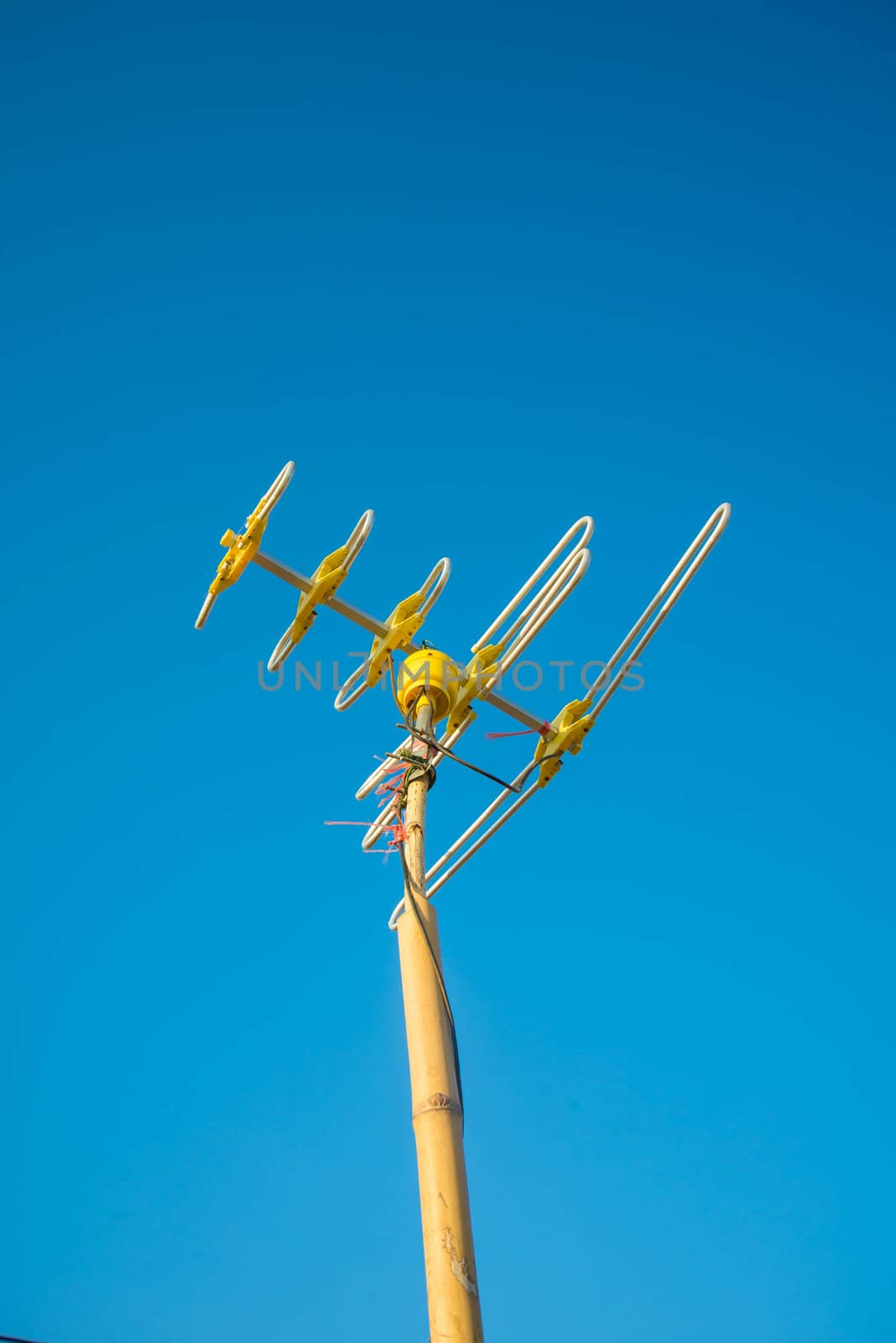 Antenna Television and blue sky background.