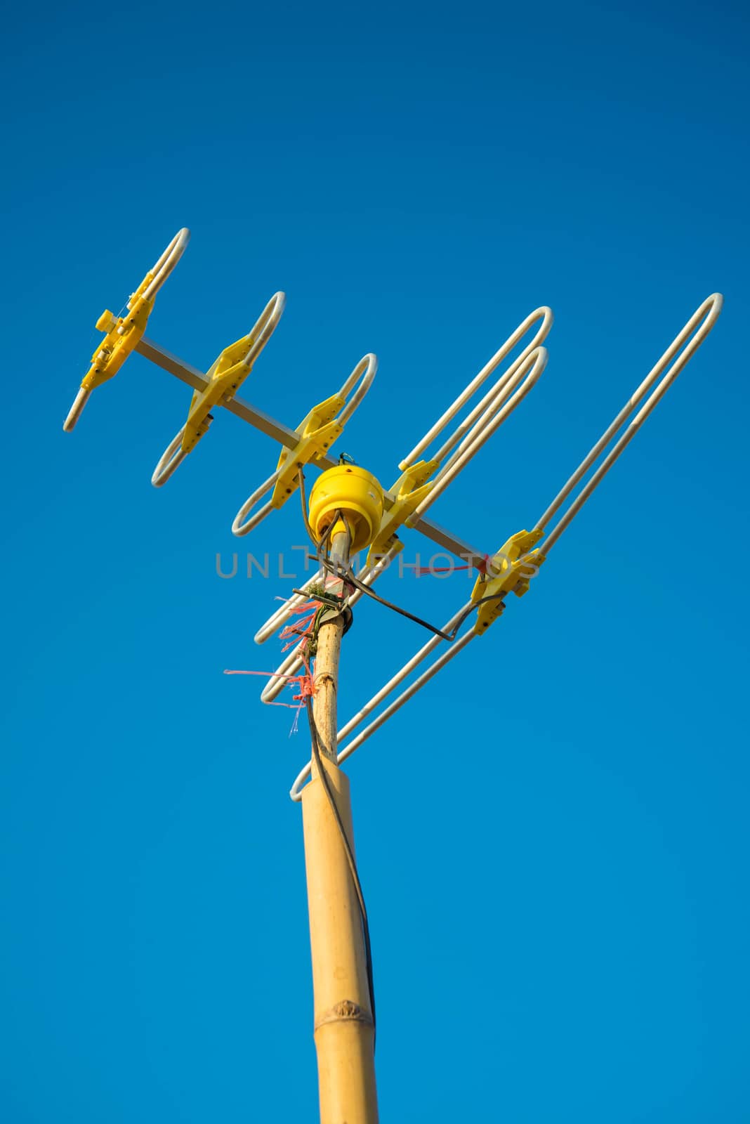 Antenna Television and blue sky background.