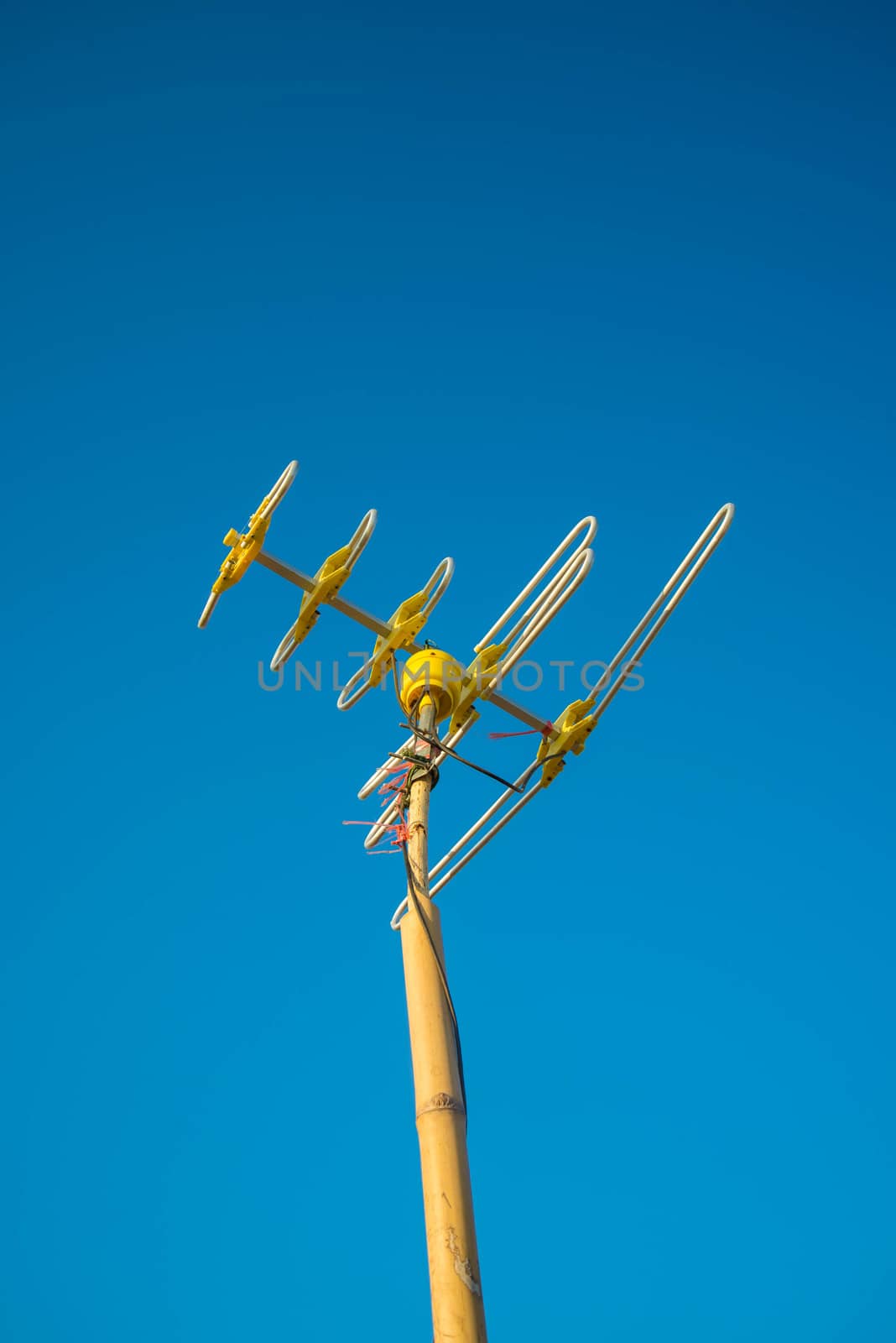 Antenna Television and blue sky background.