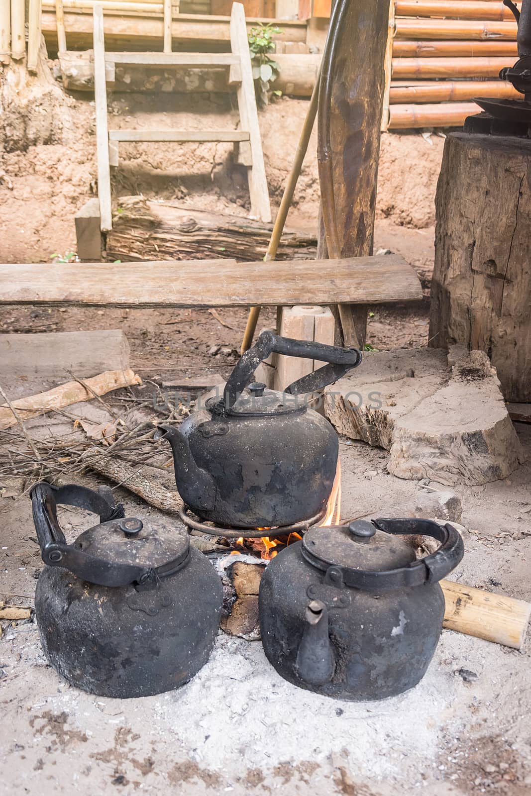 kettle boiling on stove in the kitchen tribal rural north of Tha by rakoptonLPN
