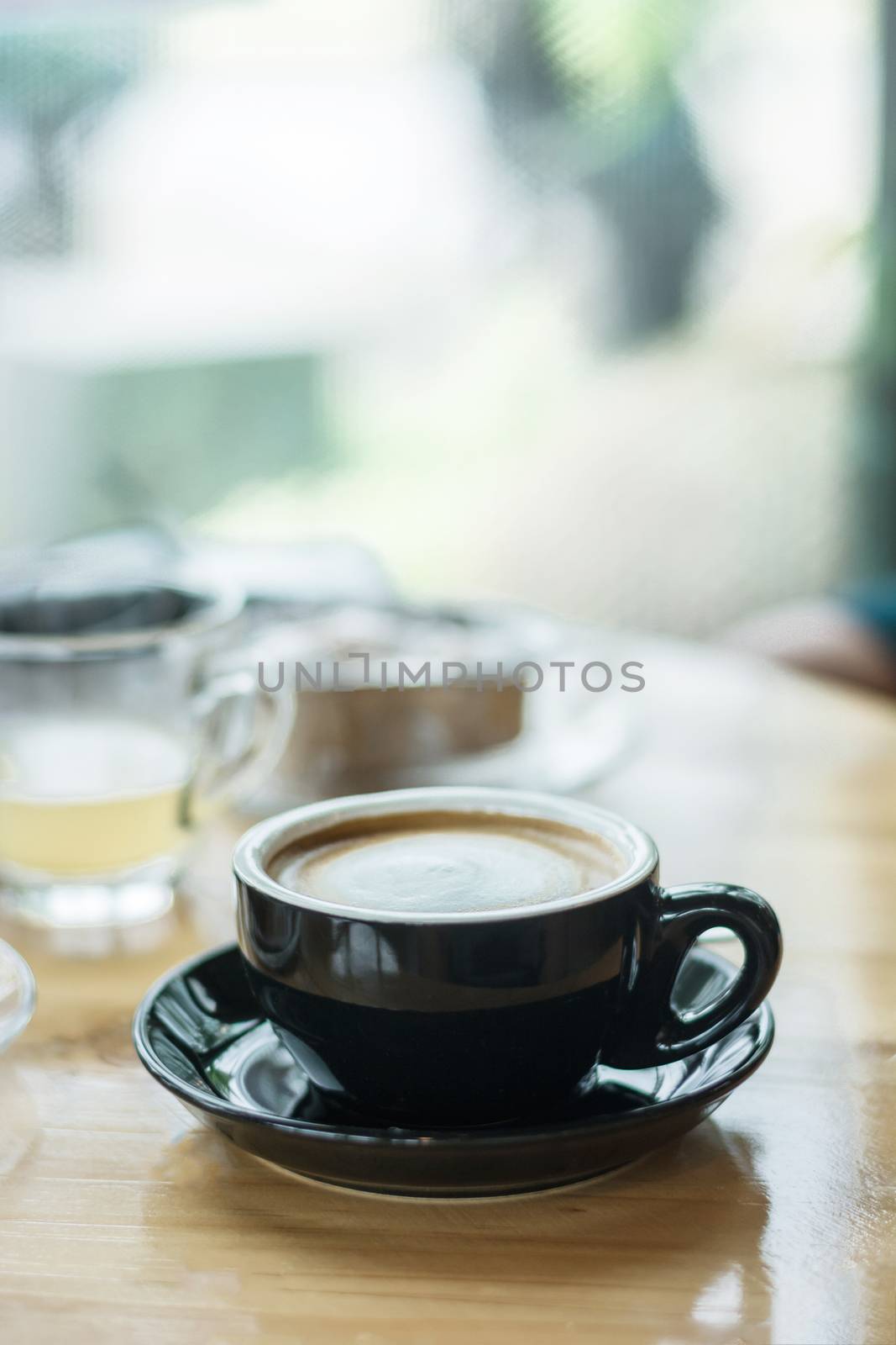 Soft focus on latte coffee cup, coffee for background - vintage effect process picture