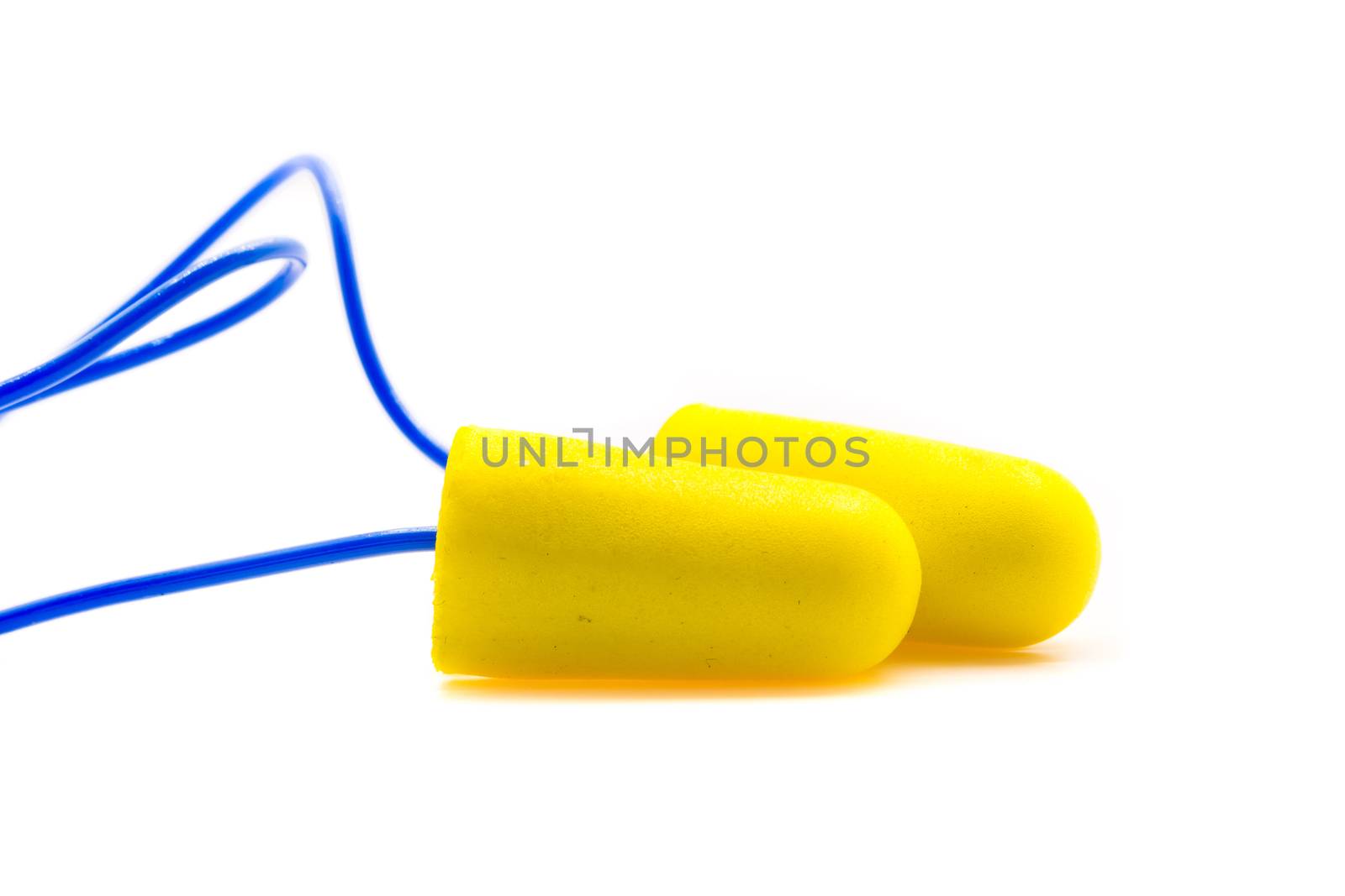 Yellow earplugs with blue band on white background.